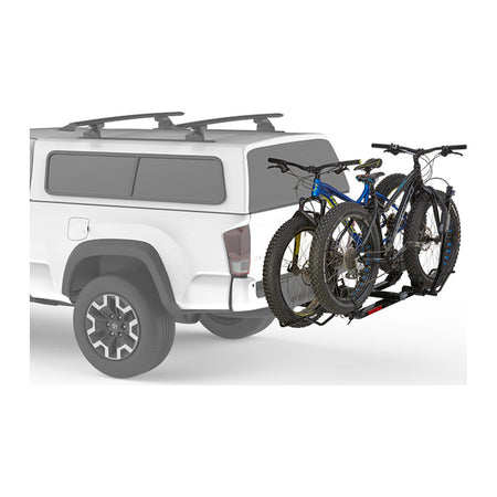 Two mountain bikes on the HoldUp EVO behind a ute