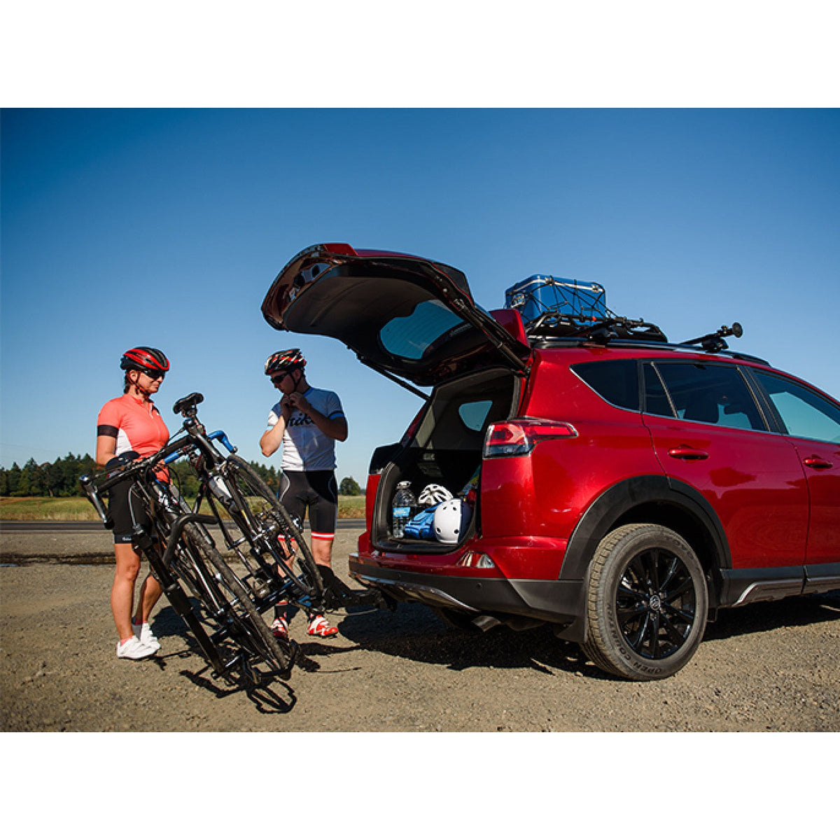 Open hatch on a red SUV with the rack tilted down