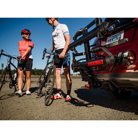 Road cyclists beside the HoldUp EVO in the sun