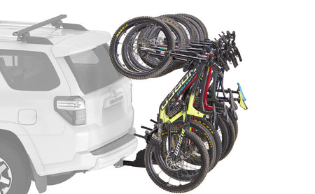 Six bikes hanging off the back of an SUV